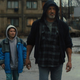 the main actors walking in the street
